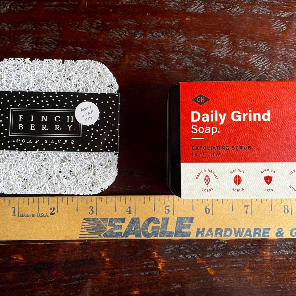 daily grind exfoliating soap with black tin soap box and soap saver